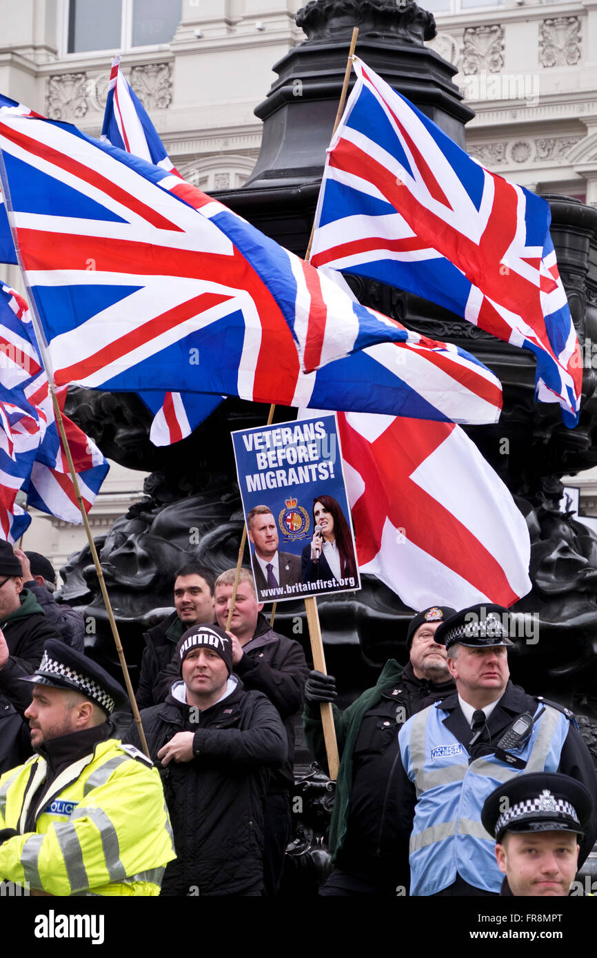 Britain First, a right wing racist group gather and try to disrupt the Stand Up against Racism March through London Stock Photo