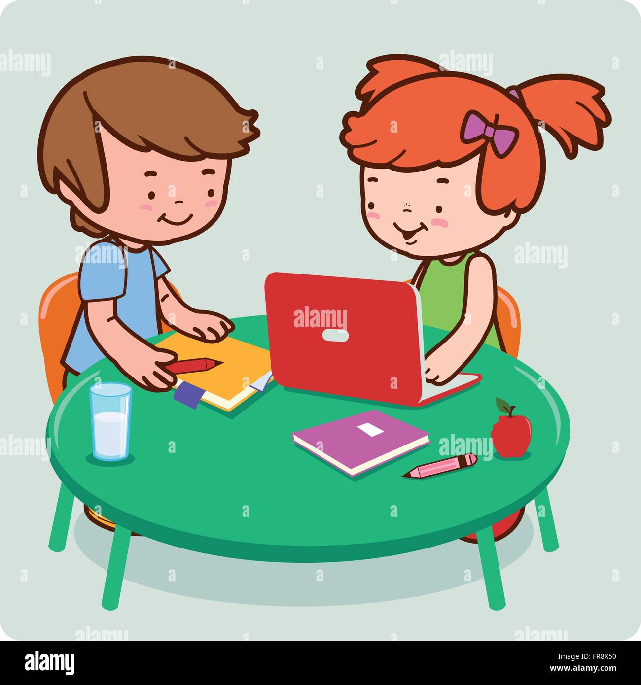 Student classmates at a desk at school do their homework using a ...