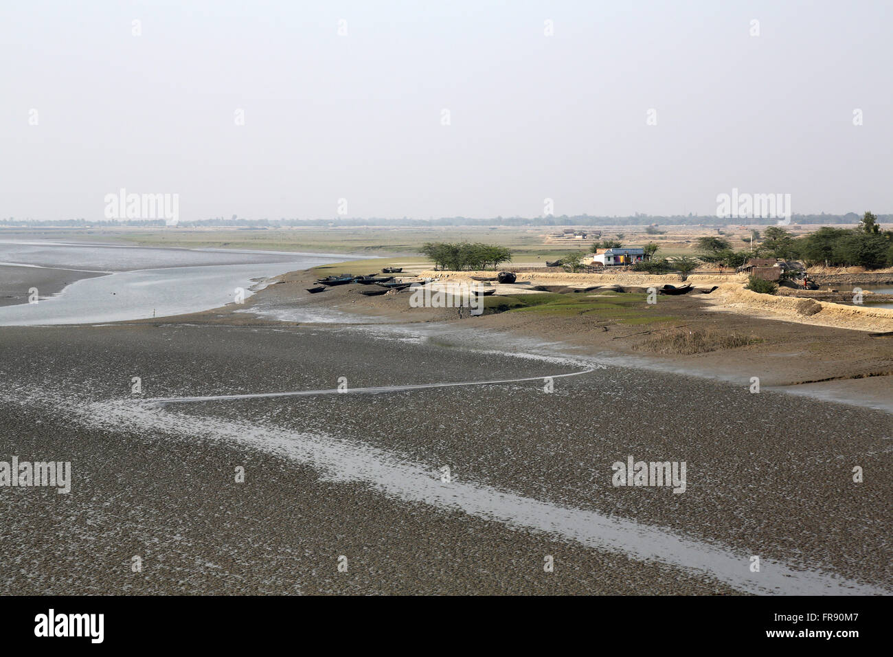 Mud beds on the river Matla during low tide the water in the Canning