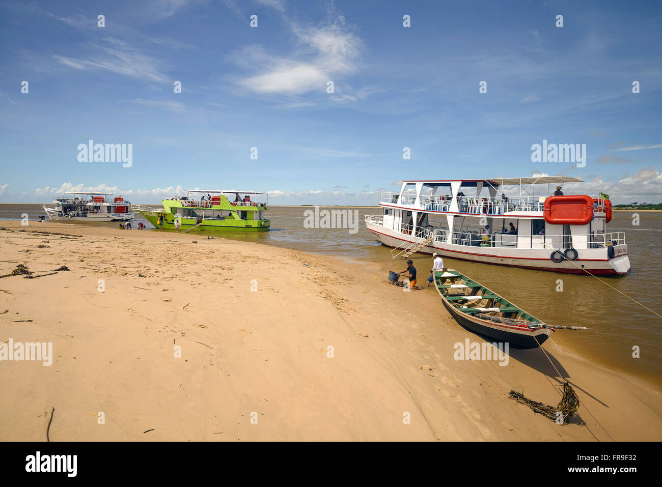 Tourist boats anchored on the shore of Igaraçu River - a tributary of the Rio Parnaíba Stock Photo