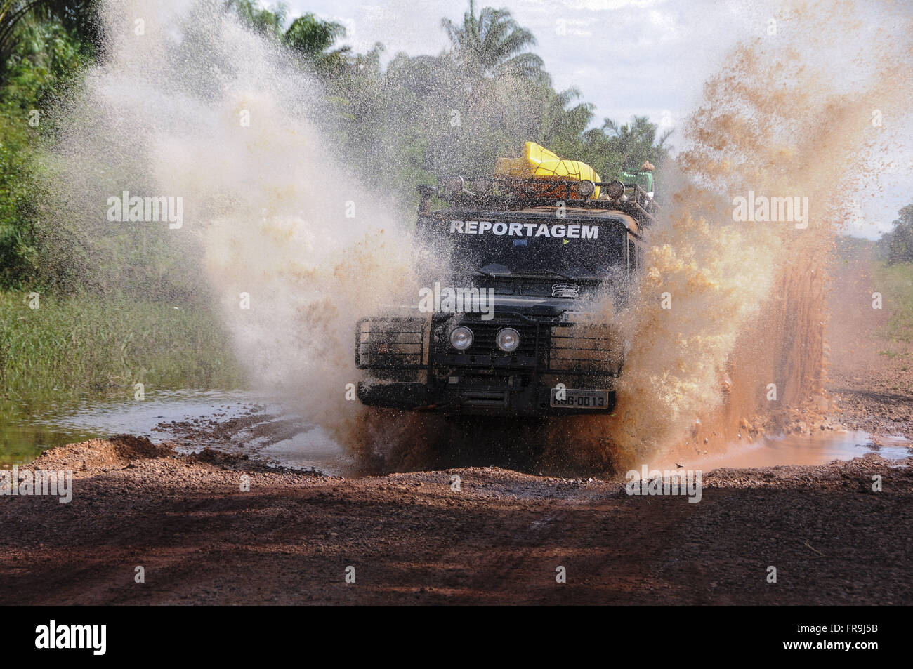 Jeep reporting through gunk on the River Aripuana Stock Photo