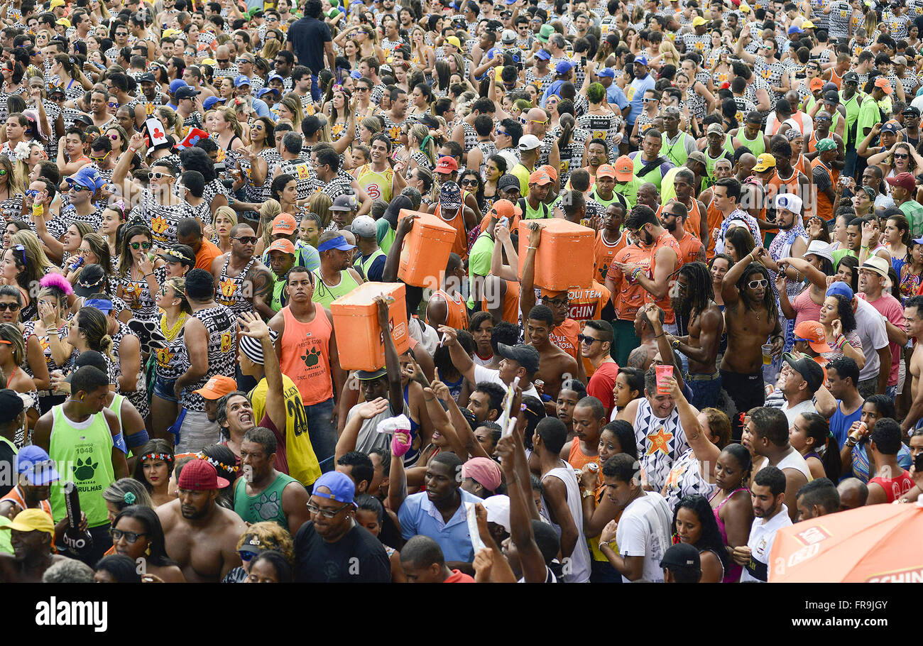 Hawkers among revelers during Carnival in Farol da Barra Stock Photo