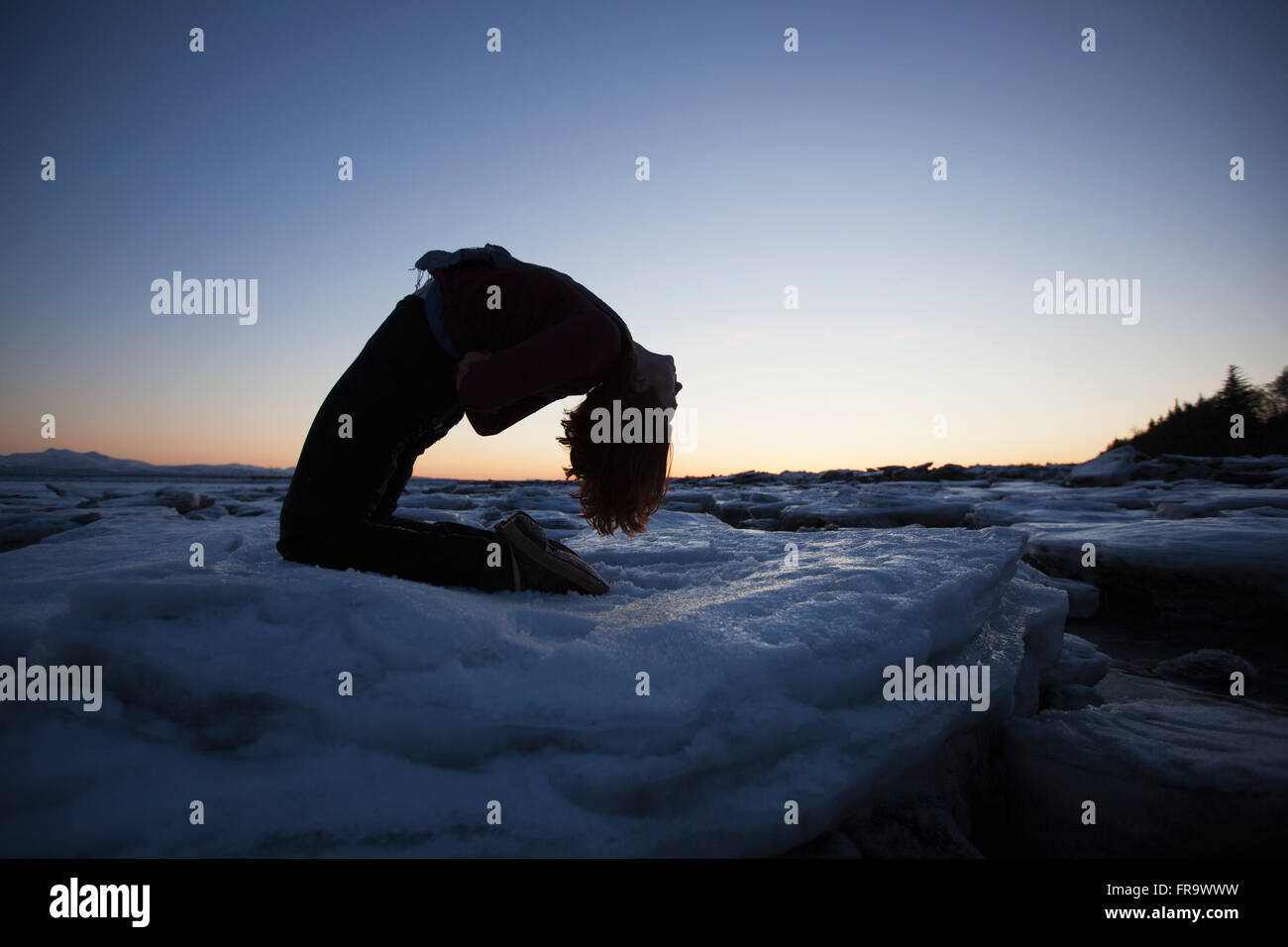 Woman kneeling silhouette hi-res stock photography and images - Alamy