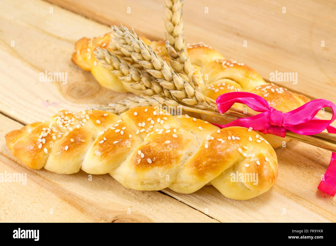 Homemade braid pastry with wheat plant and a ribbon Stock Photo