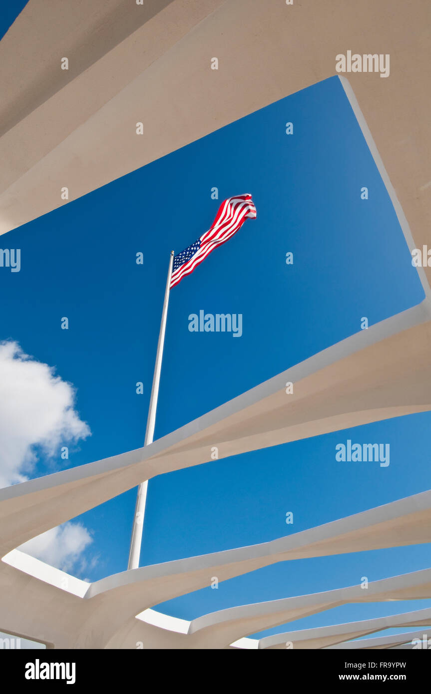 The American flag flies over the USS Arizona Memorial in Pearl Harbor; Oahu, Hawaii, United States of America Stock Photo