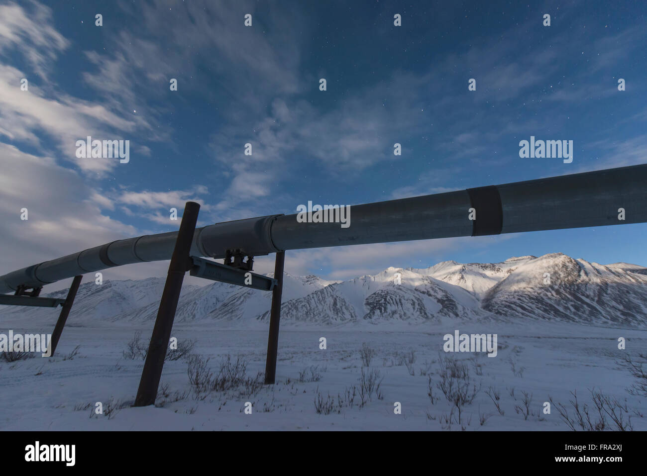 The Trans Alaska Pipeline stands out against the sky on the other side of Atigun Pass in the Brooks Range, Arctic Alaska Stock Photo