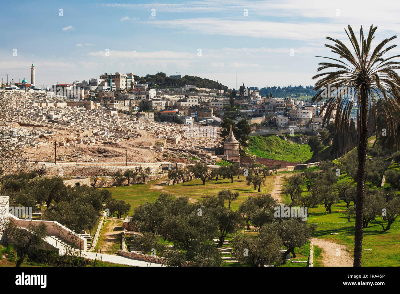 Absalom's tomb and graves in a cemetery; Jerusalem, Israel Stock Photo