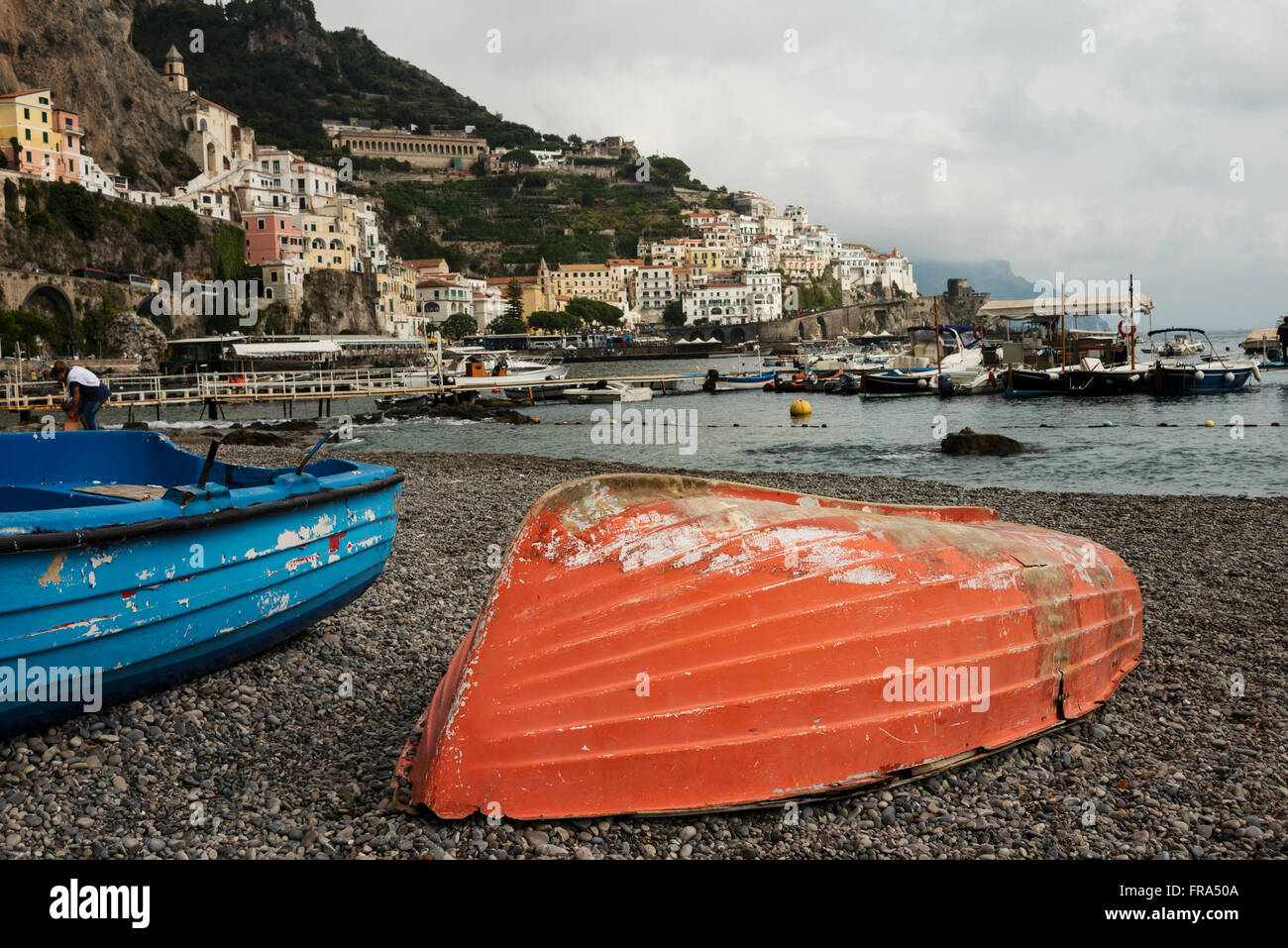 Colourful wooden boats on the shore along the Amalfi coast; Amalfi, Campania, Italy Stock Photo