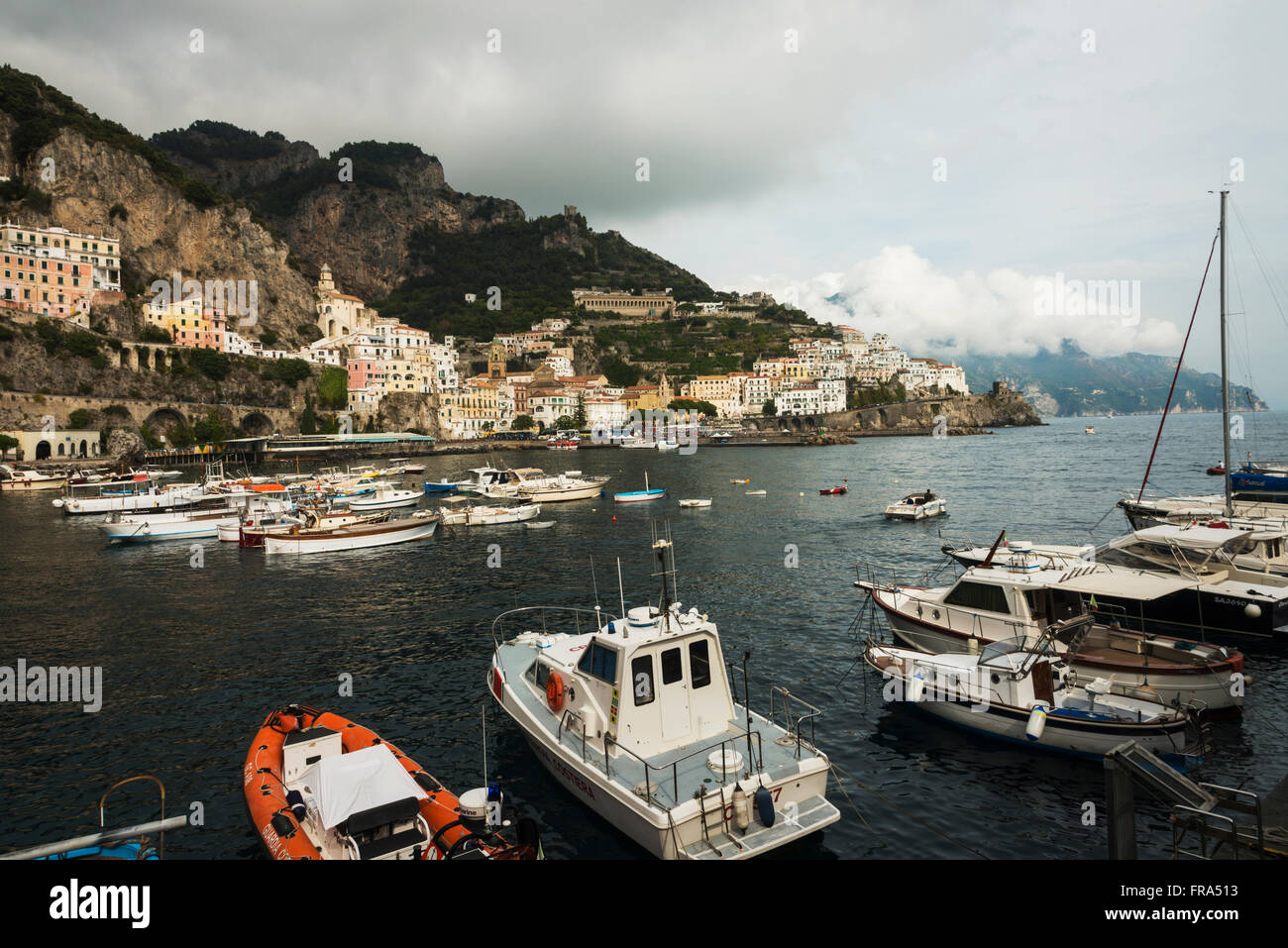 Fishing boats mooring in the harbour along the Amalfi coast; Amalfi, Campania, Italy Stock Photo
