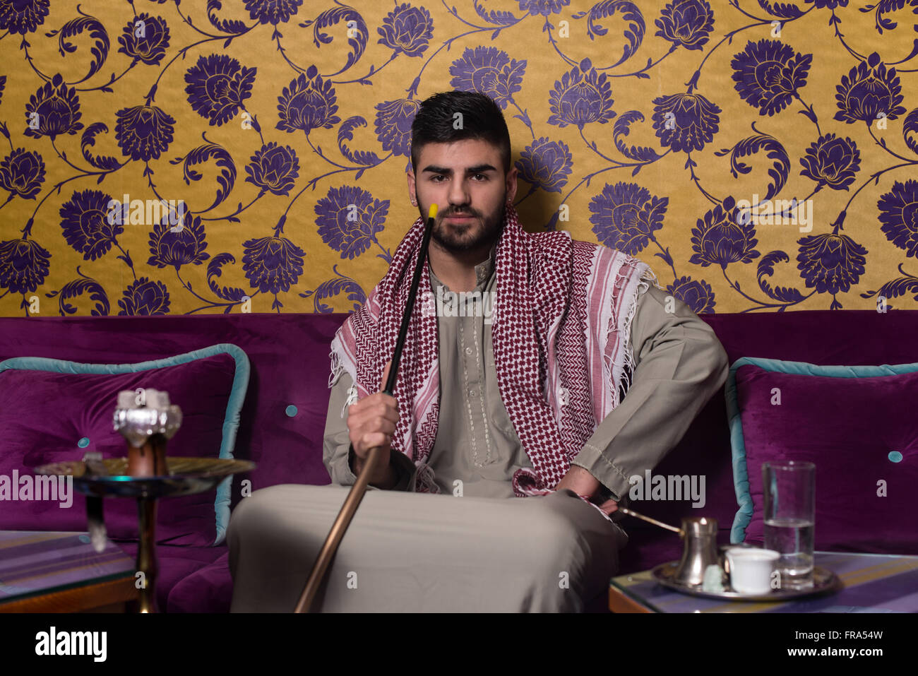 Arab man smoking shisha on hi-res stock photography and images - Alamy