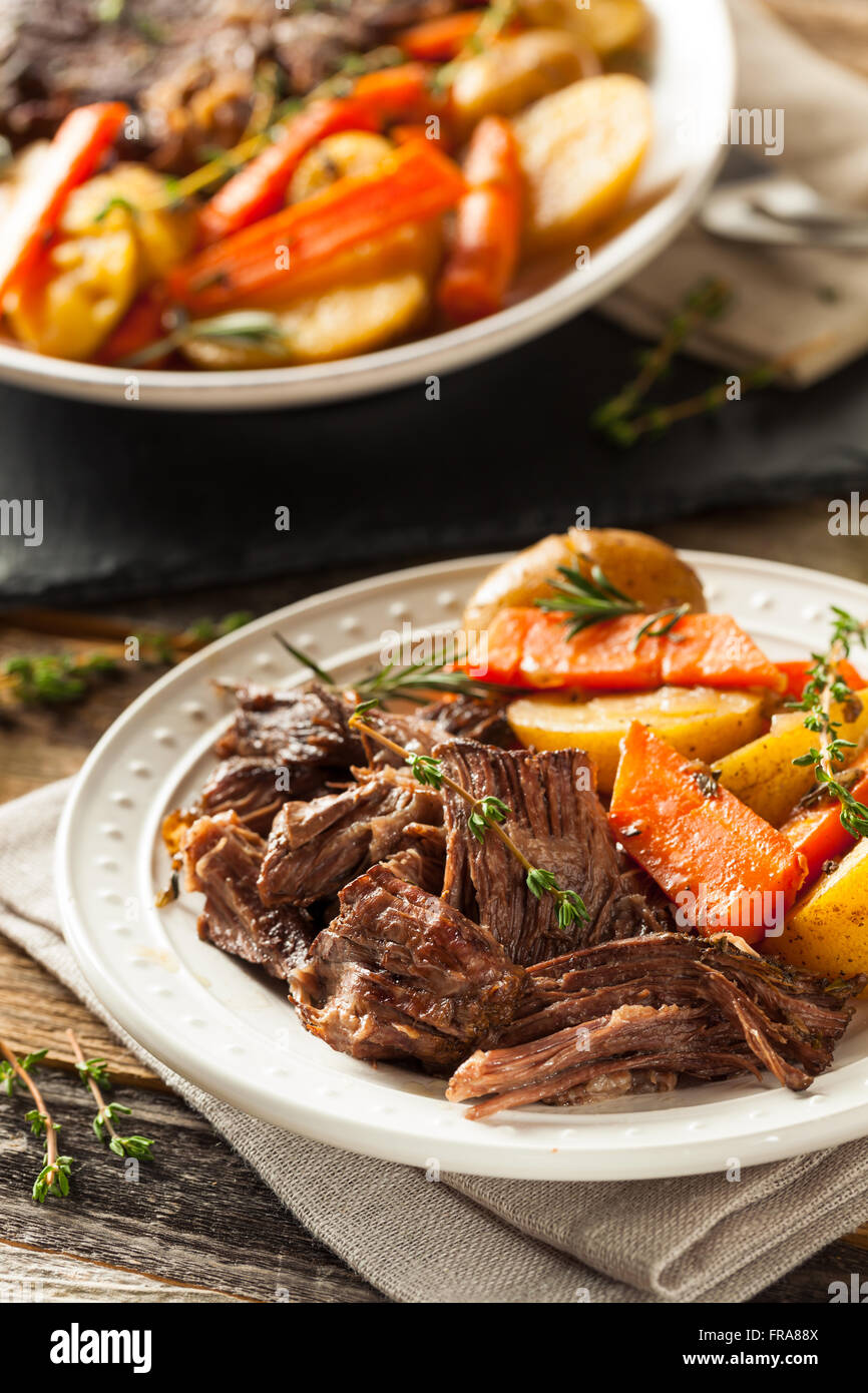 Homemade Slow Cooker Pot Roast with Carrots and Potatoes Stock Photo