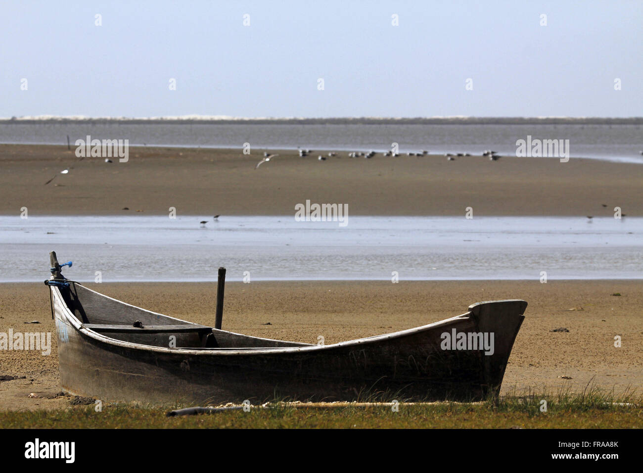 Canoe shrimp fisherman on the edge of Lagoa do Peixe in Tavares - RS Stock Photo