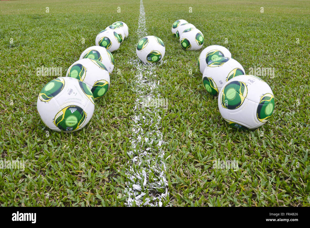 Balls close to the demarcation line on football field Stock Photo