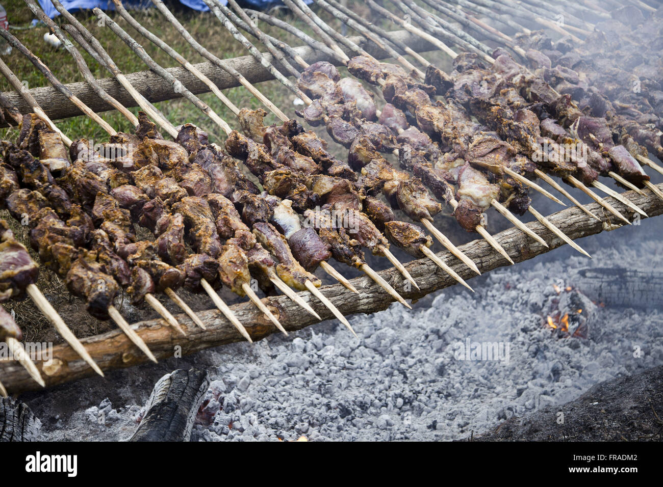 BBQ skewers offered by revelers in religious festivals Stock Photo