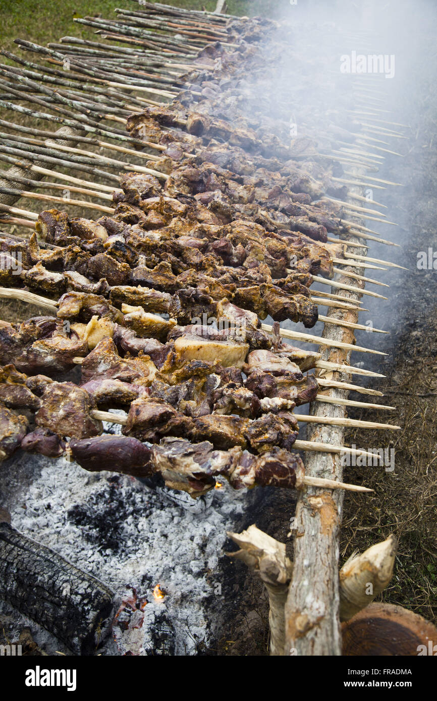 BBQ skewers offered by revelers in religious festivals Stock Photo