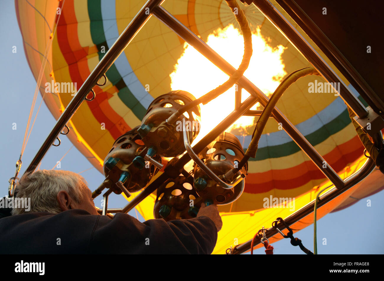 Pilot triggering device to inflate balloon flight for tourism in the Maasai Mara National Reserve Stock Photo