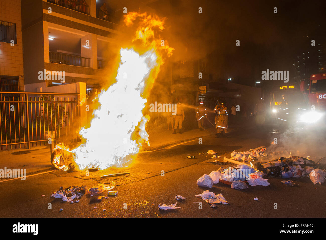 Firefighters putting out fire during protest on Independence Day in Orange neighborhood Stock Photo