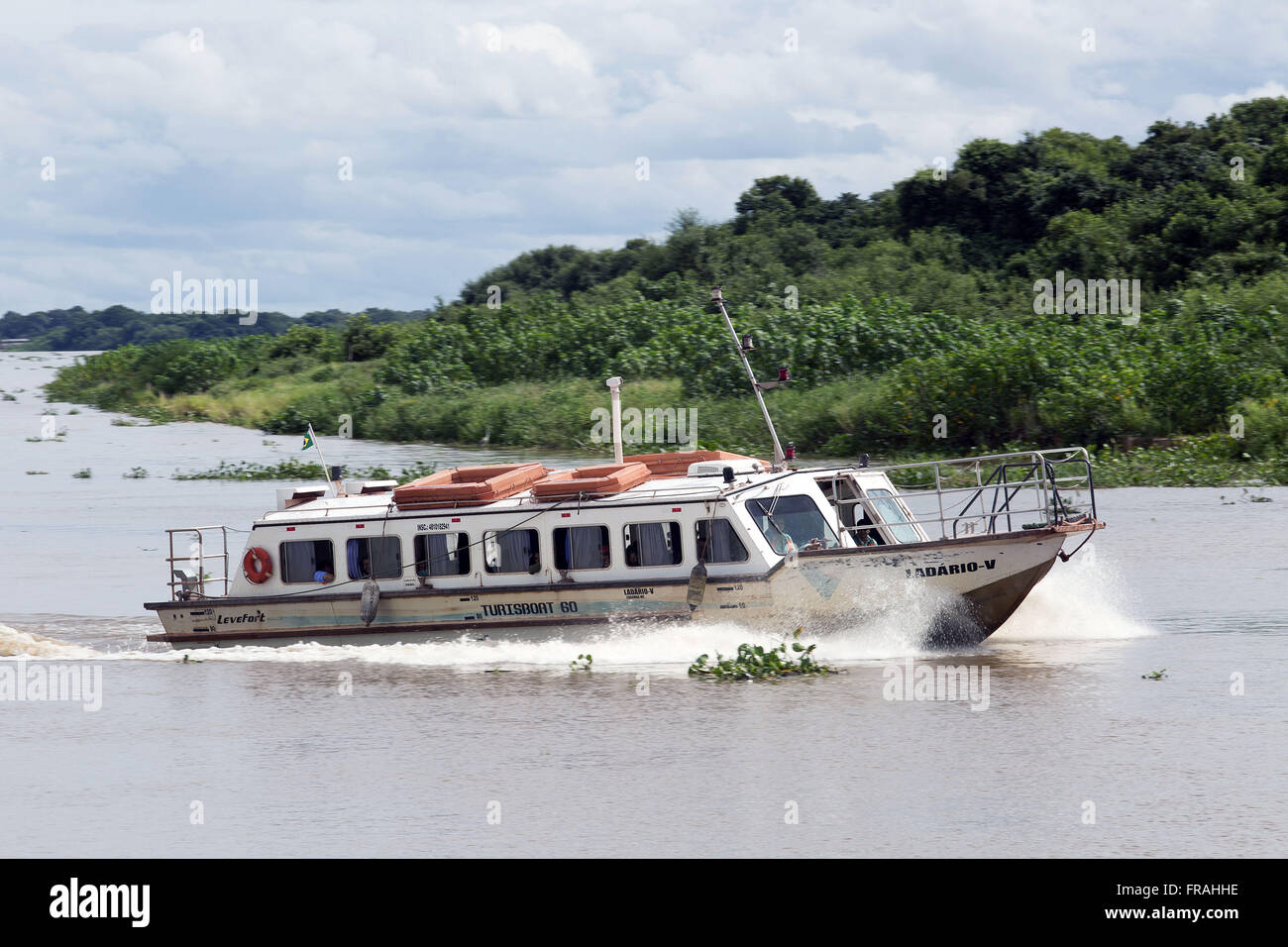 Boat transport employees of mining on the Paraguay river Stock Photo
