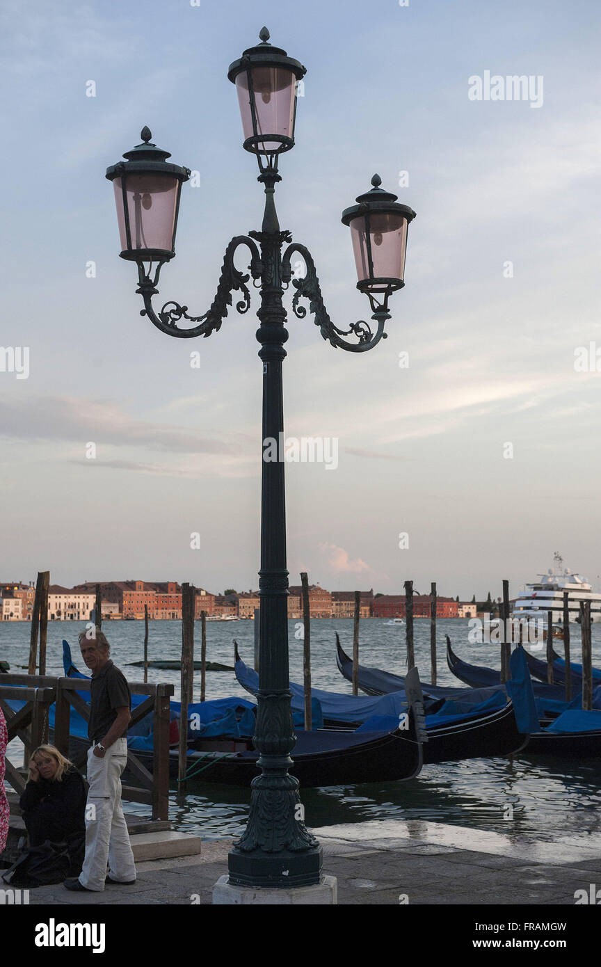 Gondolas the bank of the Grand Canal in Venice - the Veneto region Stock Photo