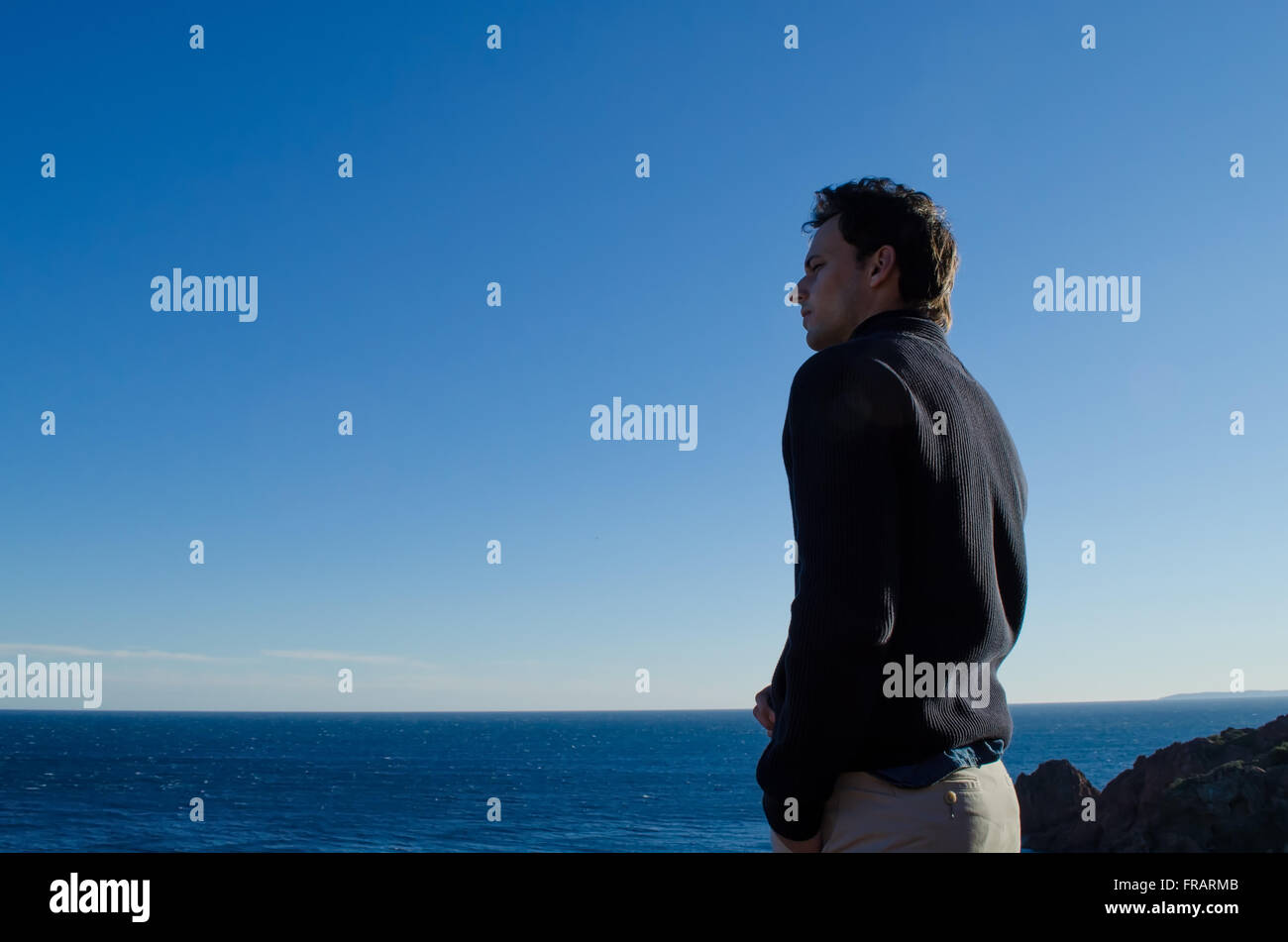 A man thinking and looking at the horizon Stock Photo