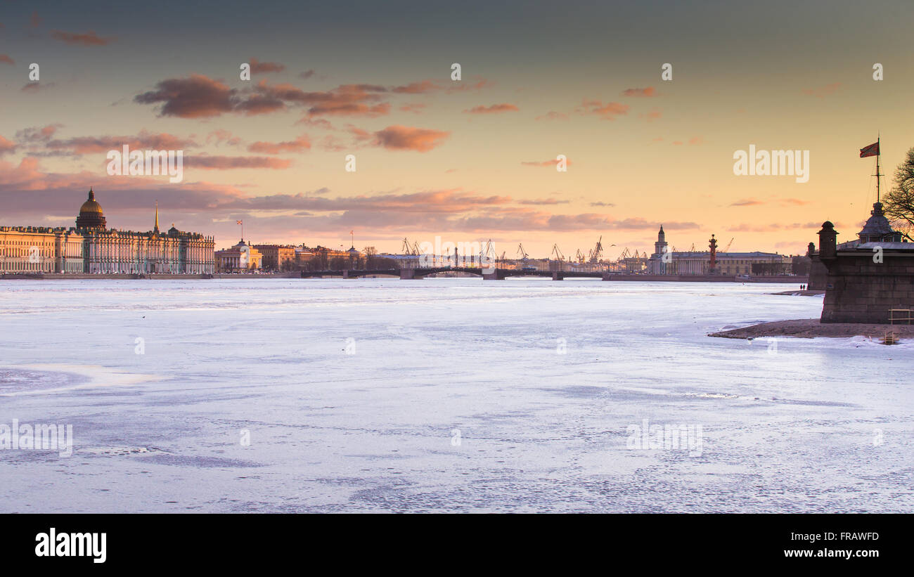 Russia, Saint-Petersburg, 19 March 2016: The water area of the Neva River at sunset, the Winter Palace, Palace Bridge, the dom Stock Photo