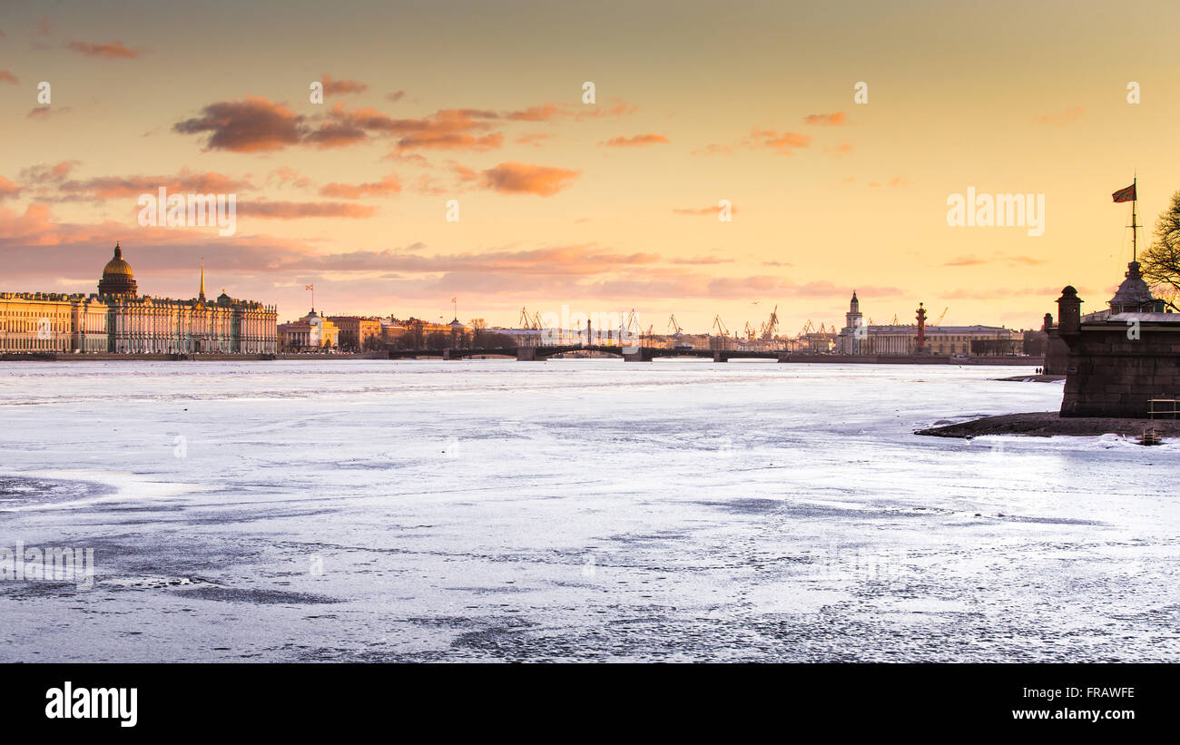 Russia, Saint-Petersburg, 19 March 2016: The water area of the Neva River at sunset, the Winter Palace, Palace Bridge, the dom Stock Photo