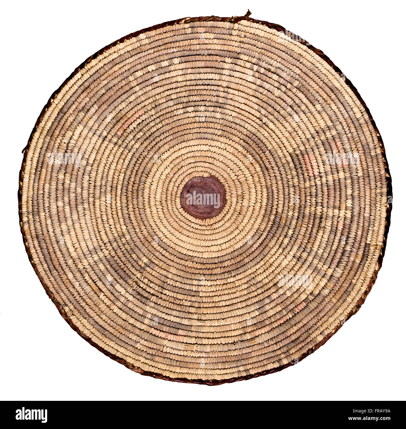 A studio photo of the back side of a shallow woven Egyptian basket used for wind winnowing grain Stock Photo