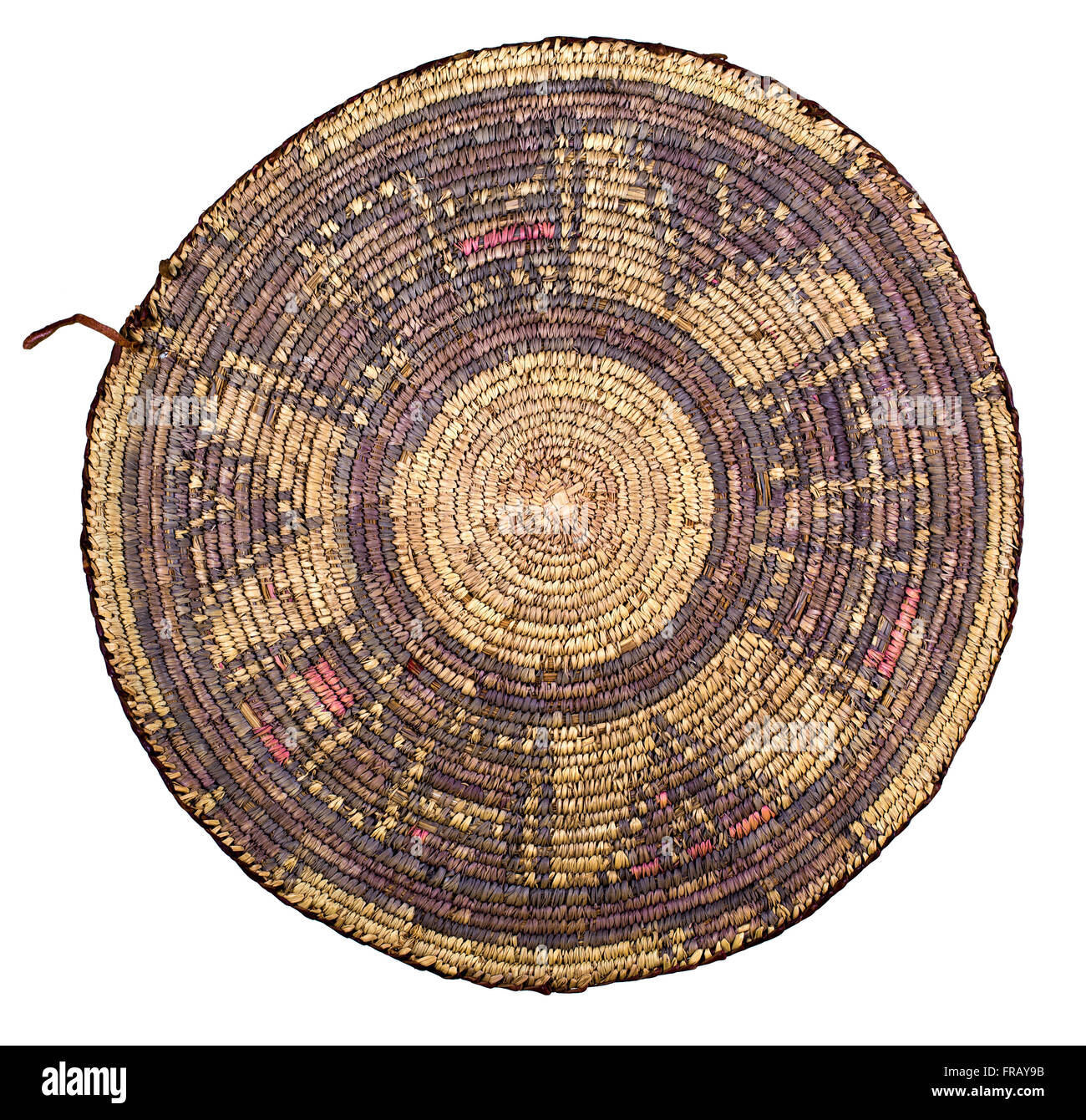 A studio photo of a shallow woven Egyptian basket used for wind winnowing grain Stock Photo