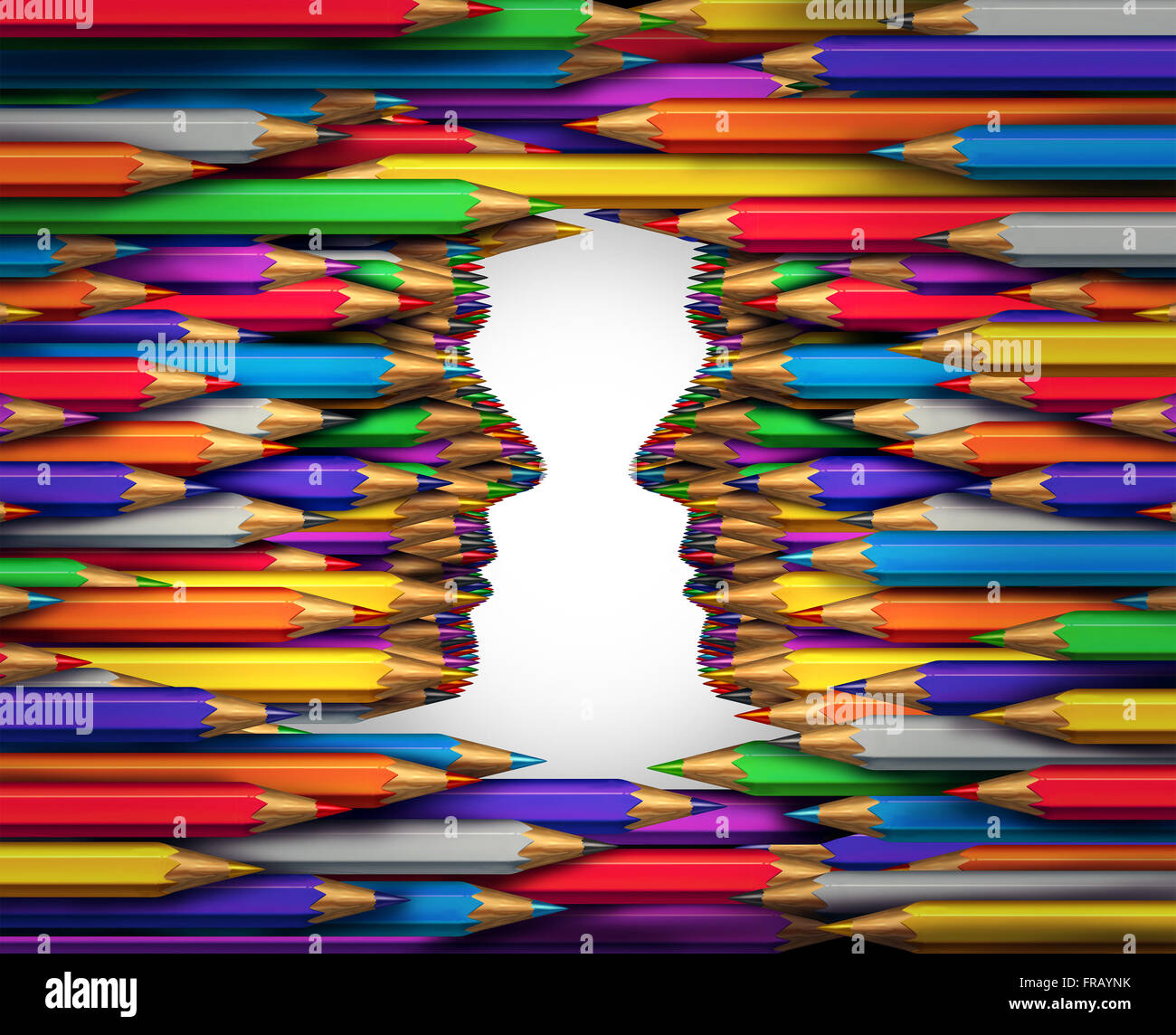 Creative exchange concept as a group of colored pencil crayons shaped as two human heads facing each other as a creativity collaboration and art direction and design communication metaphor. Stock Photo