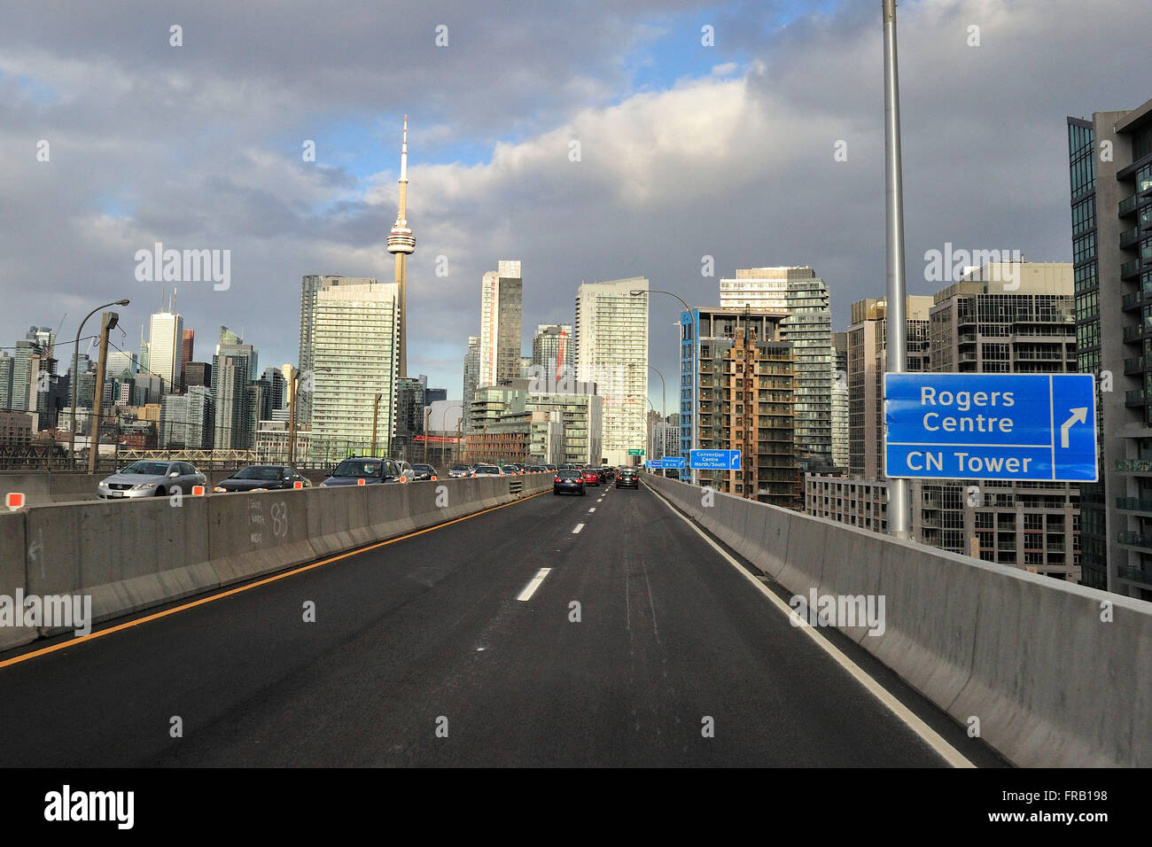 Afternoon traffic is seen as cars and other vehicles travel eastbound on the QEW, in Toronto on March 21, 2016. Stock Photo