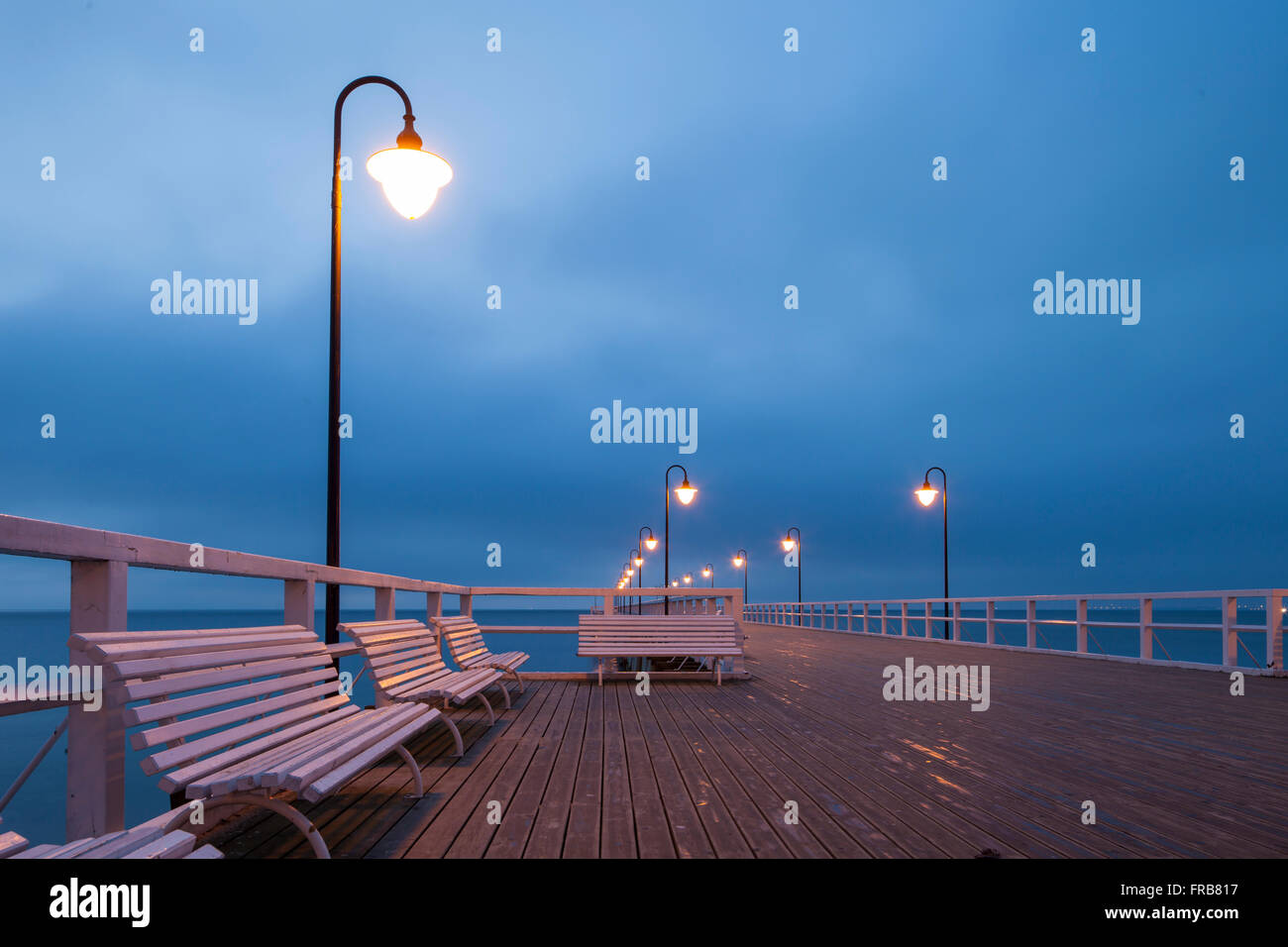 Moody winter dawn at Orlowo Pier in Gdynia, Poland. Stock Photo