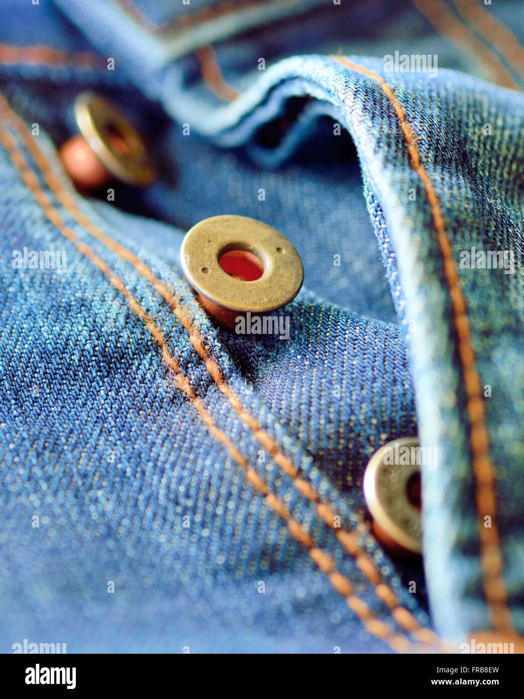 Front piece of the blue jeans. Open buttons fly. Button macro. Jeans button  Stock Photo - Alamy