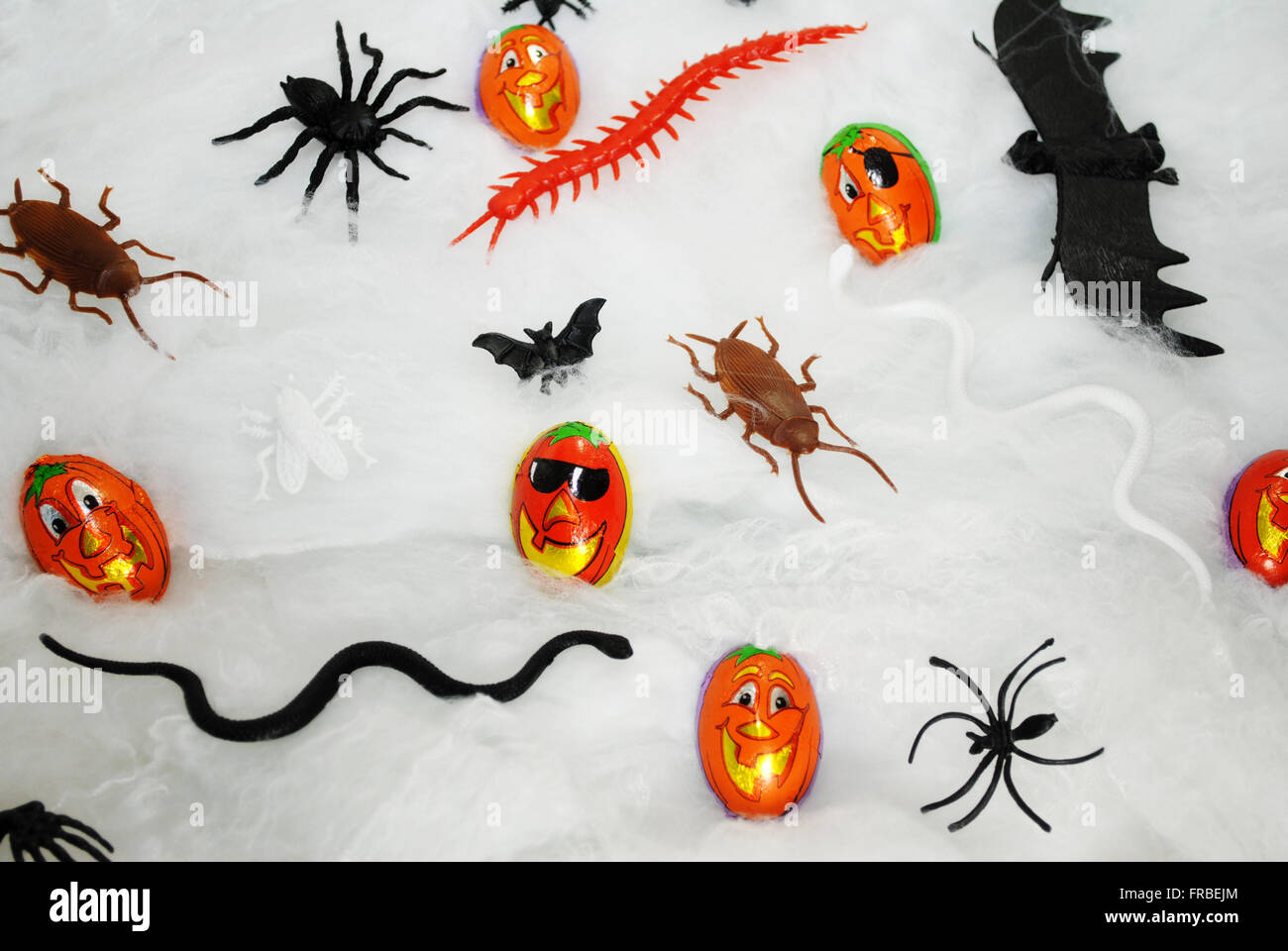Spooky Halloween Toys and Pumpkin Candies Stock Photo