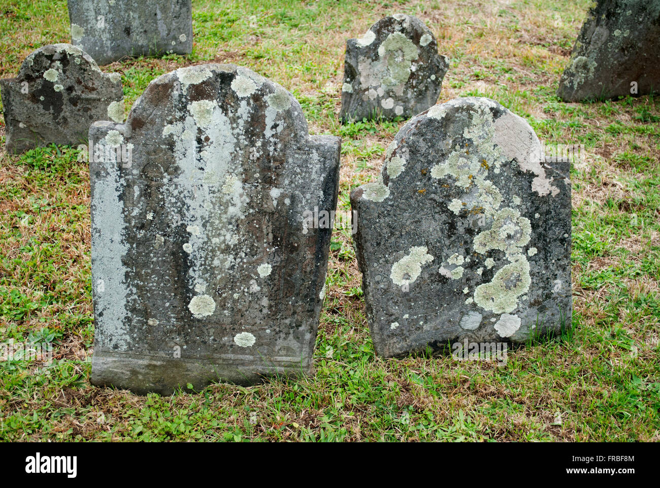 Old and Spooky Grave Stones in a Cemetery Stock Photo