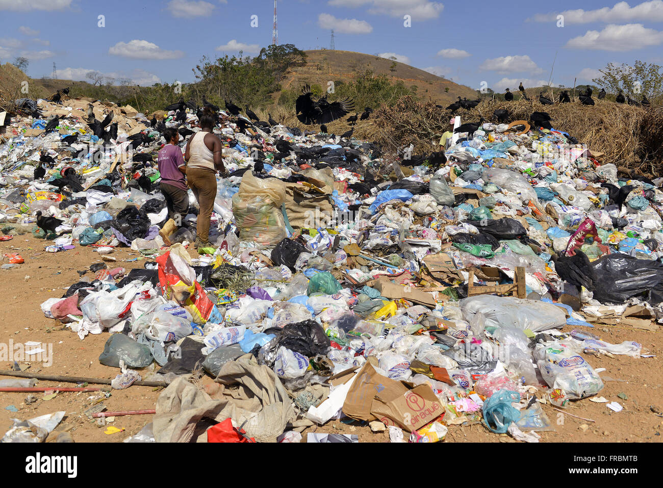 Pickers of recyclable garbage deposit in the open sky at km 17 of the BR-040 highway Washington Luiz Stock Photo