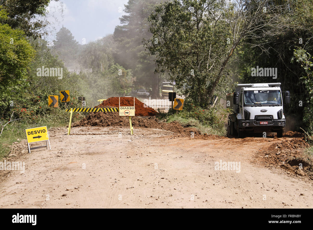 Works on the access road to the municipality Stock Photo