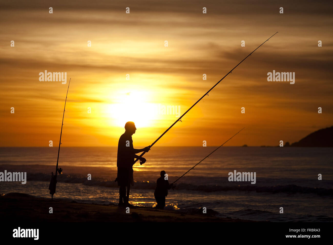 Two people beach fishing hi-res stock photography and images - Alamy