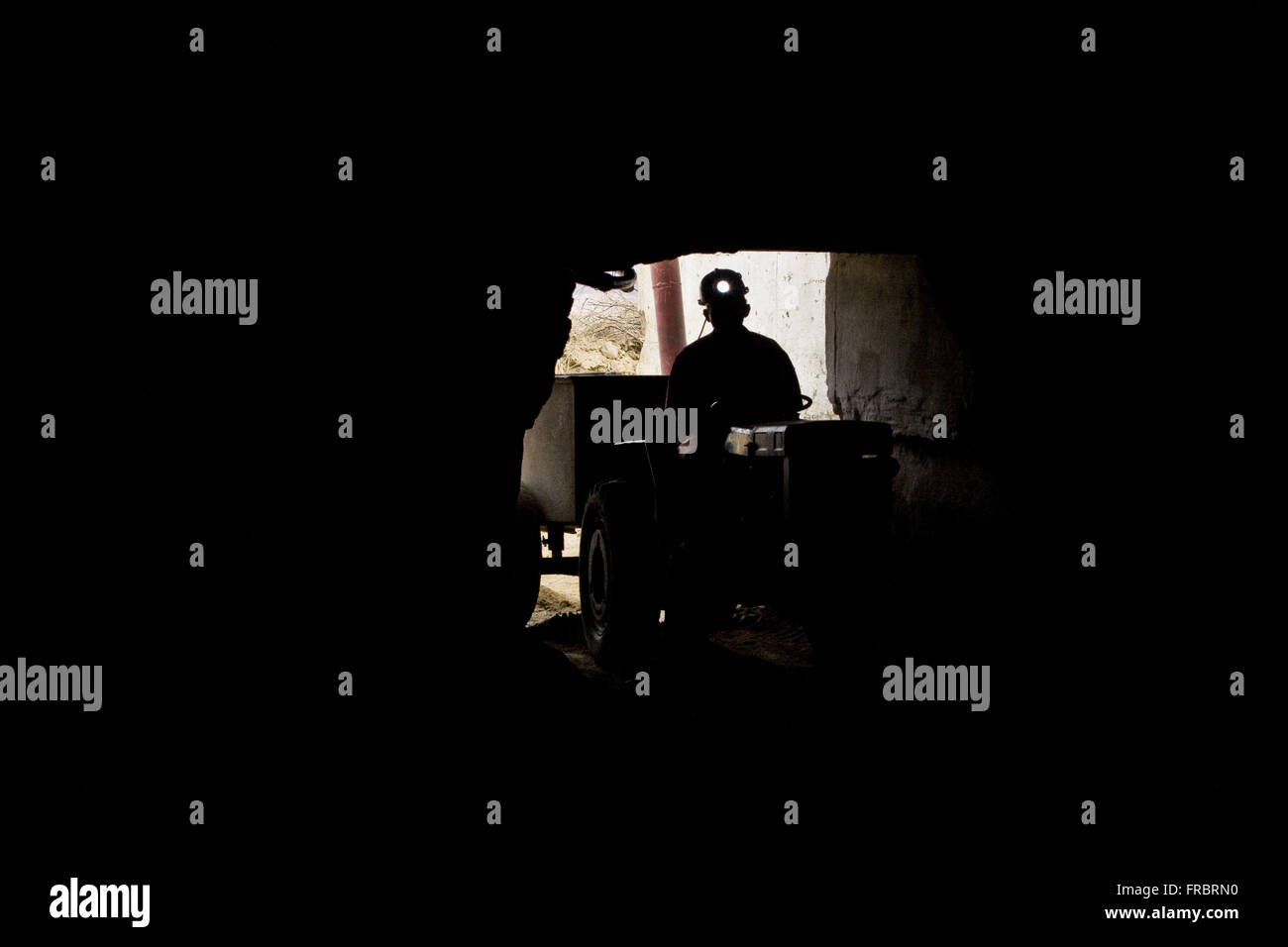 Worker in tunnel excavation for the extraction of scheelite - the region served Stock Photo