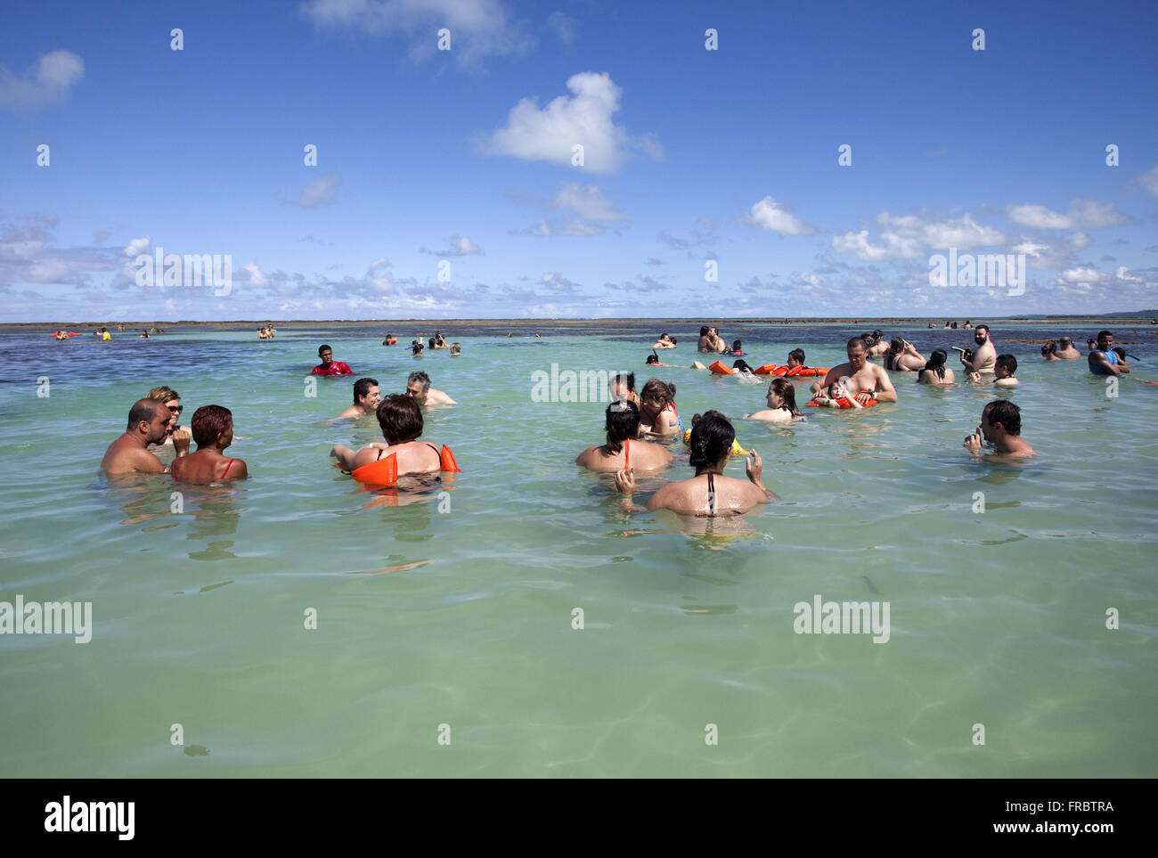 Tourists ride on over coral reef in Maragogi Beach Stock Photo