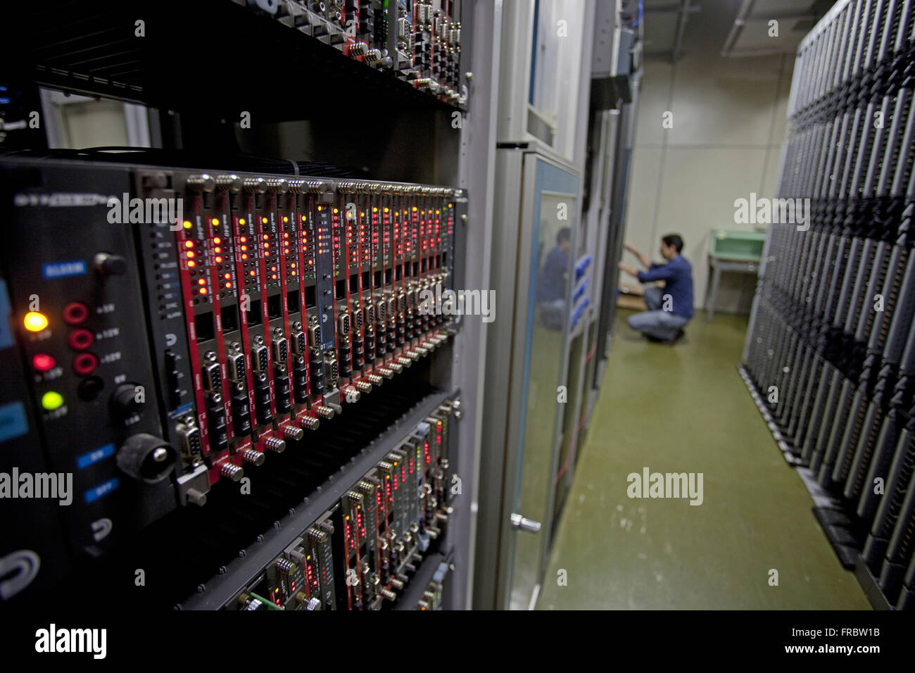 Worker in central servers and processors in telecommunications carrier Stock Photo