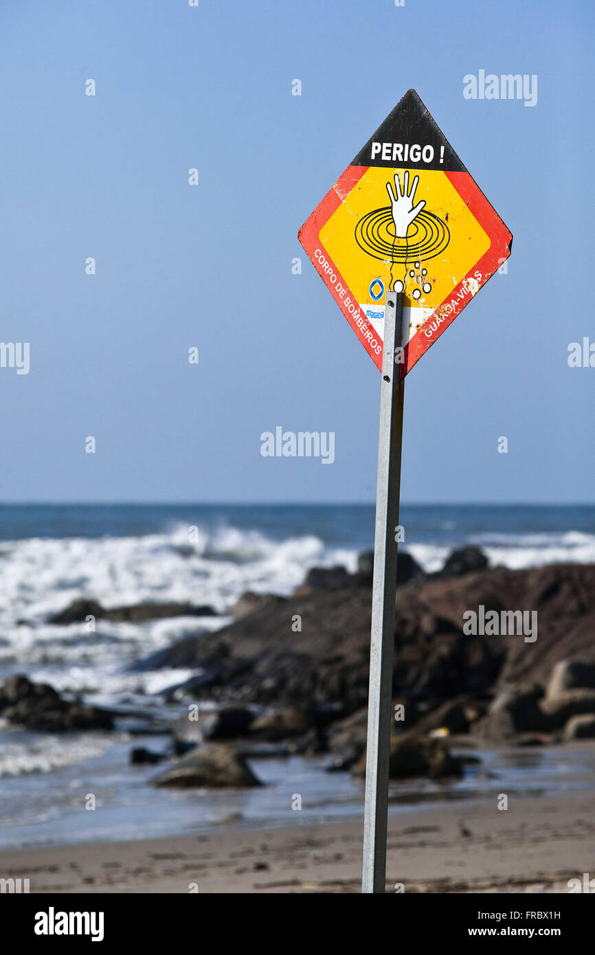 Sign indicating risk of drowning in the Ilha do Mel, State Park of Ilha do Mel Stock Photo