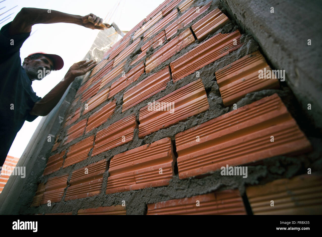 Laborer working on construction of building Stock Photo