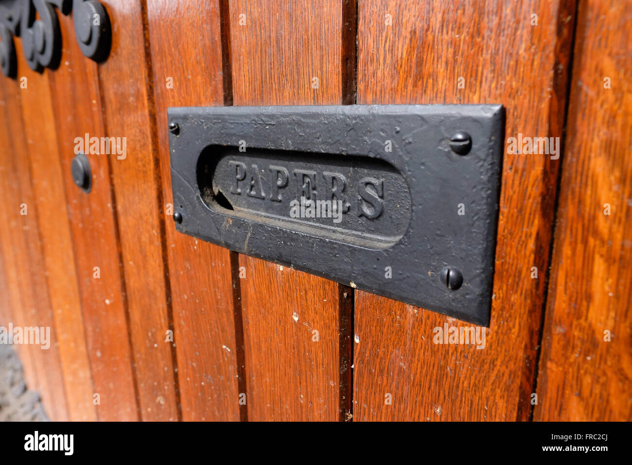Mail slot in antique wooden door hires stock photography and images