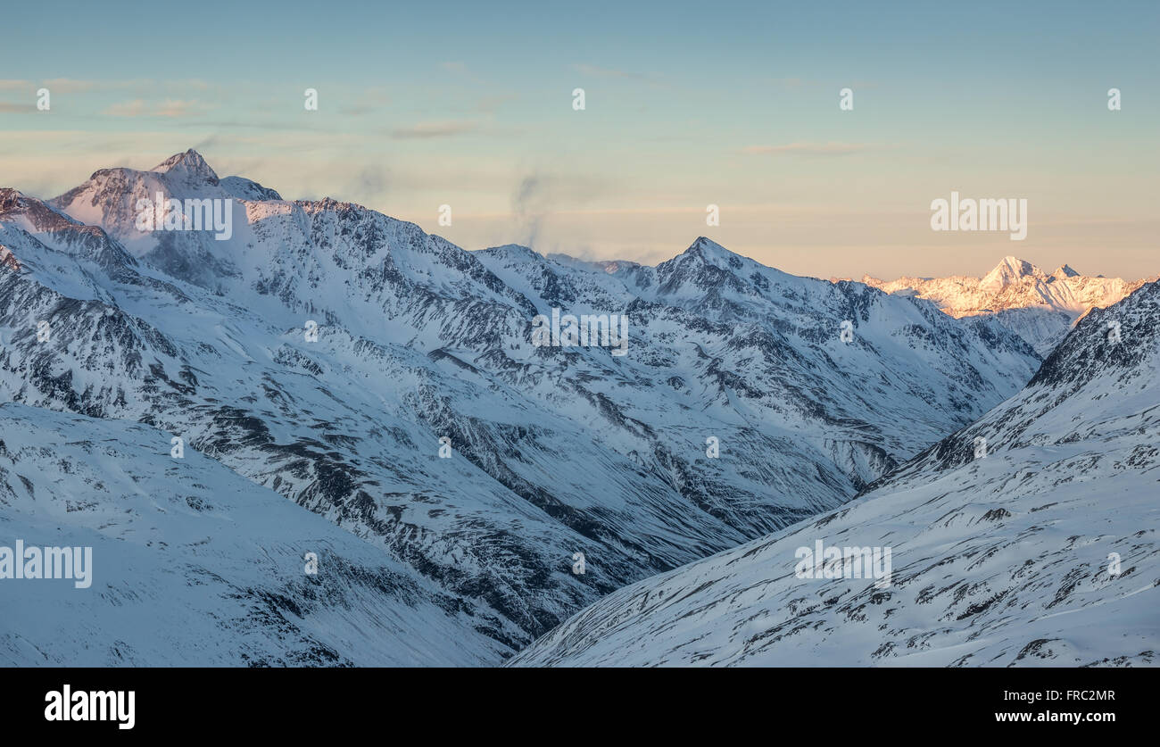 Snowy Alps at dusk Stock Photo