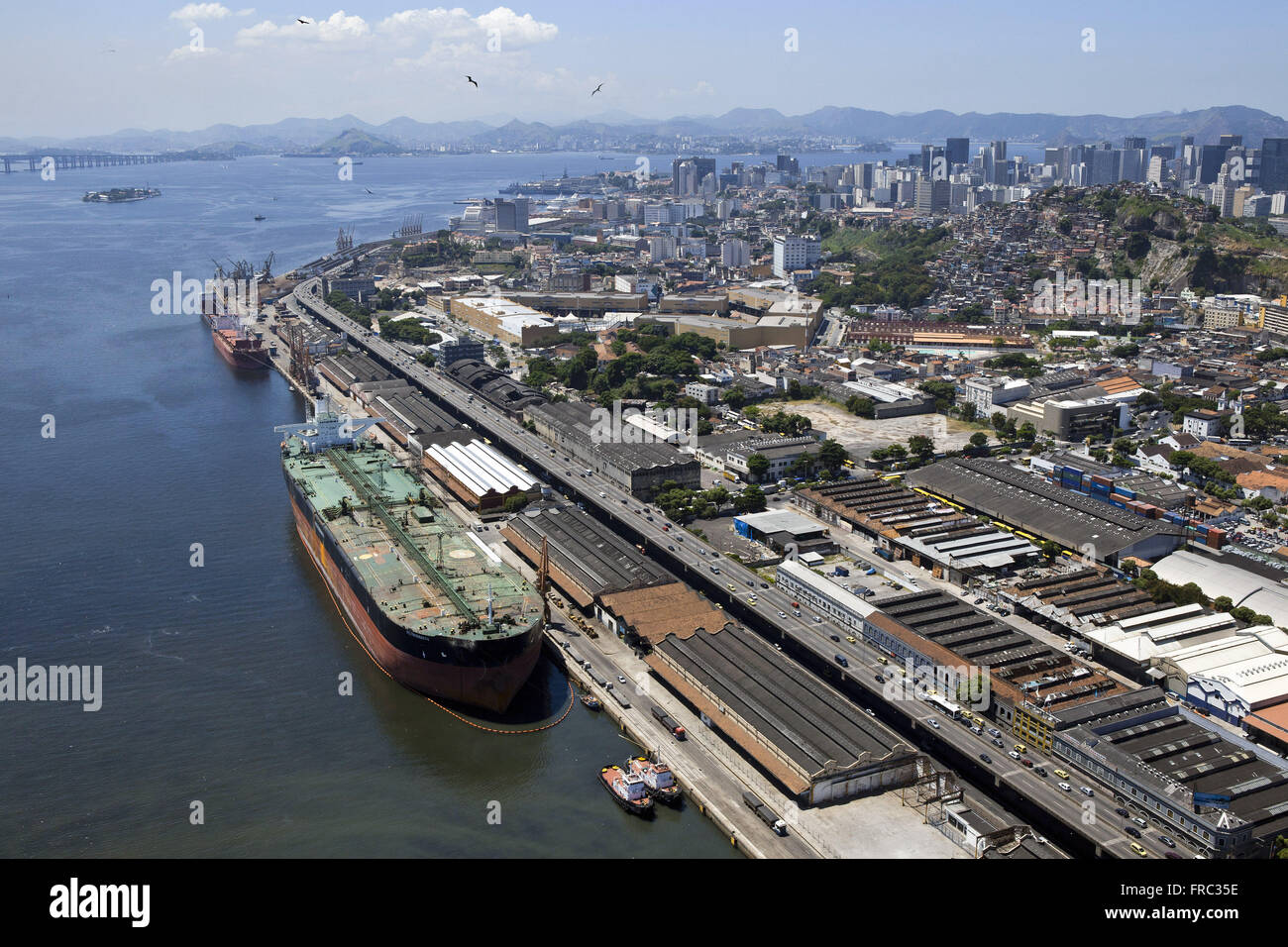 Aerial view of cargo ship at the Port of Rio de Janeiro and Perimeter Avenue Stock Photo