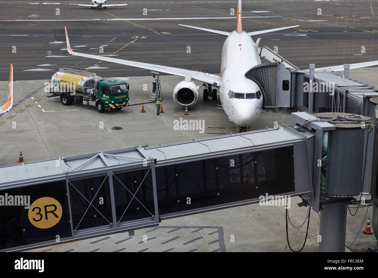 Boarding bridge and supply aircraft in Salgado Filho International Airport Stock Photo