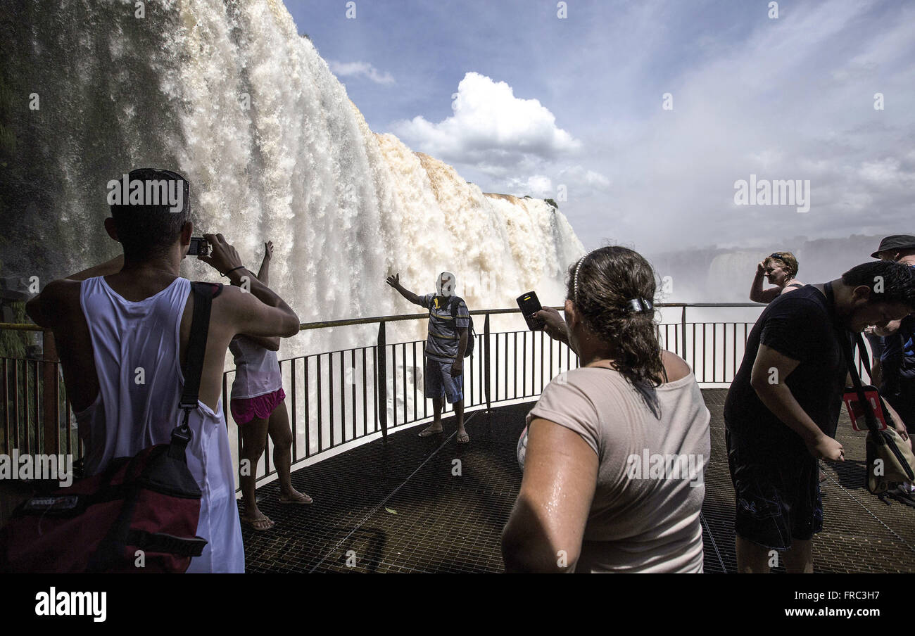 Tourists include the Iguaçu Falls from lookout Stock Photo