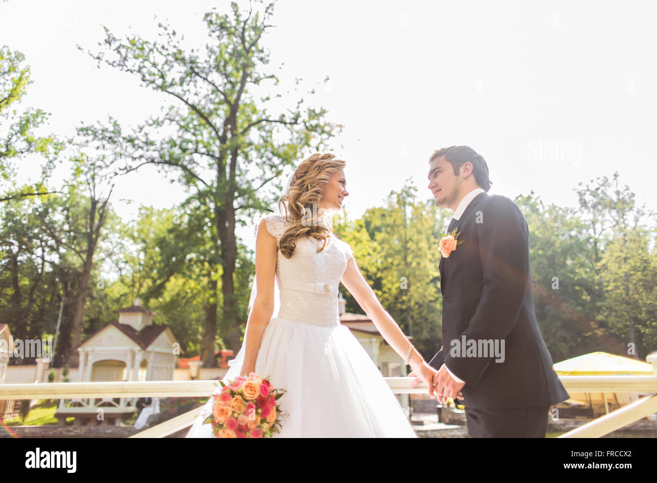 Beautiful wedding couple in park Stock Photo - Alamy