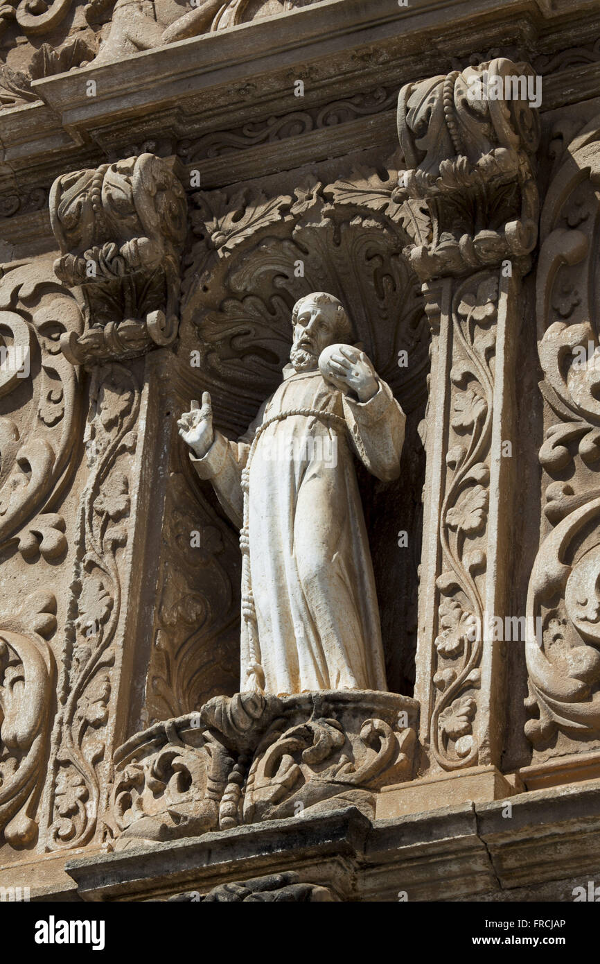 Statue of St. Francis Penitent - stone sculpture carved stonework Stock Photo