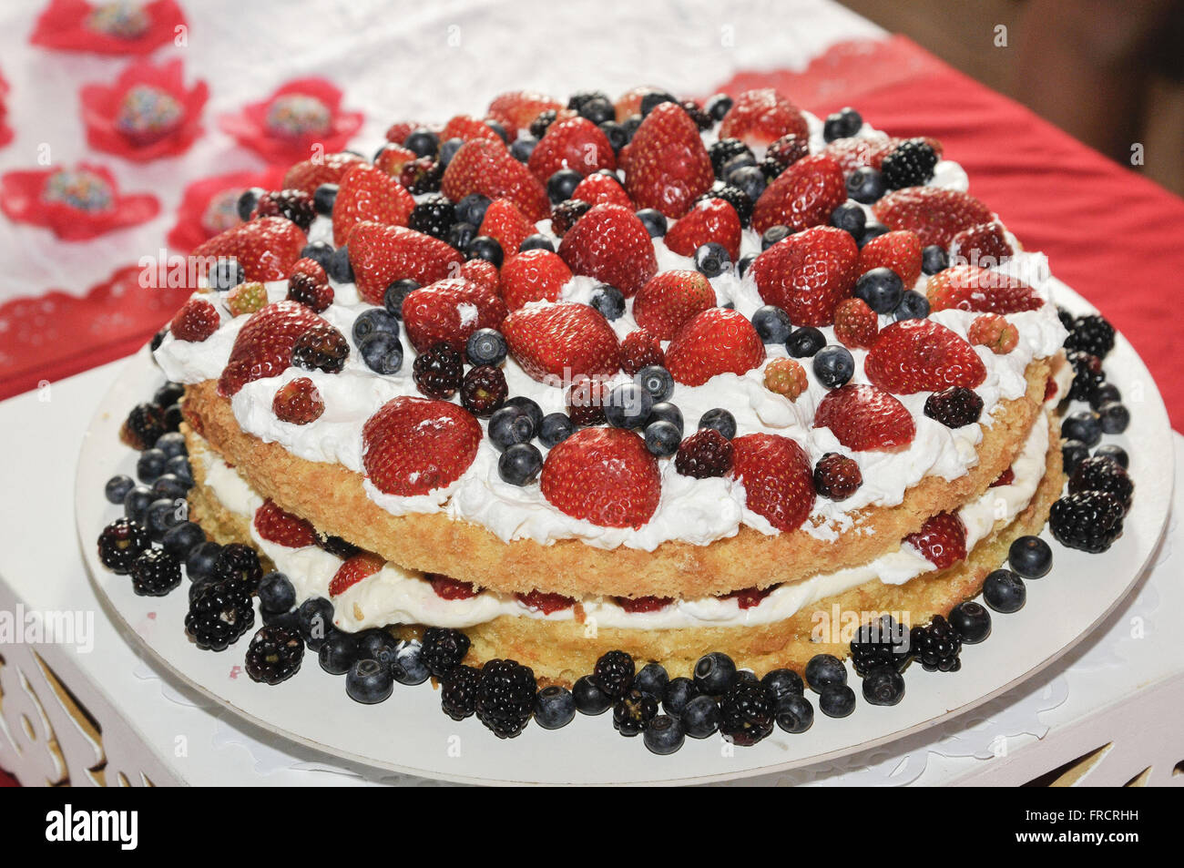 White cake with berries Stock Photo